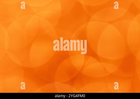 A minimalist background image featuring soft, overlapping circles in a warm orange hue. Stock Photo