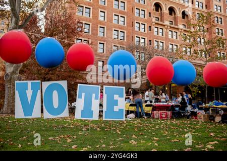 Pittsburgh, United States. 05th Nov, 2024. A row of 'VOTE' signs set up on campus highlights the importance of civic engagement and voting. Students and community members on the University of Pittsburgh campus actively participate in election day activities, engaging with information booths, campaign signs, and festive decorations that promote voter turnout and civic engagement. The event encourages young voters to exercise their rights and fosters community around the democratic process. Credit: SOPA Images Limited/Alamy Live News Stock Photo