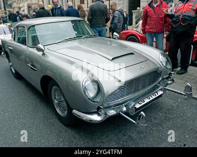 Three-quarters Front view of  the Aston Martin DB5, used to promote the film, Goldfinger, in 1964, at the St James Motoring Spectacle 2024. Stock Photo