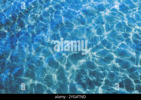 Blue  surface of the ocean with gentle ripples on the surface and light refracting Stock Photo