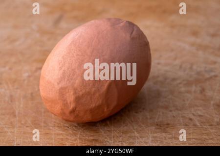 Organic hen egg with deformed and wrinkled shell Stock Photo