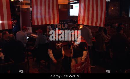 JERUSALEM - NOVEMBER 6: Supporters of Republican presidential nominee, former President Donald Trump attend an election night watch party in Mike’s Place bar on November 6, 2024 in Jerusalem. Americans cast their ballots today in the presidential race between Republican nominee former President Donald Trump and Democratic nominee Vice President Kamala Harris, as well as multiple state elections that will determine the balance of power in Congress. Stock Photo