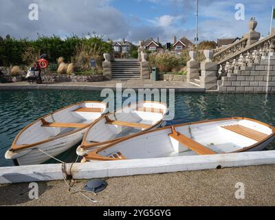 3 rowing boats moored at the Island Cafe on the Great Yarmouth Waterways Boating Lake Stock Photo