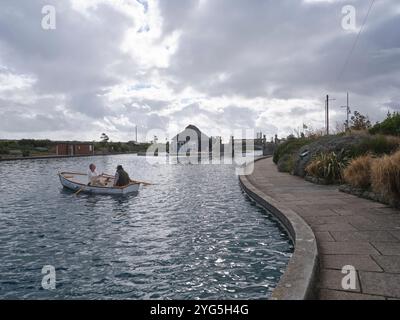 Couple in rowing boat on the Boating Lake of the Great Yarmouth Waterways Norfolk Stock Photo