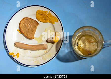 Weathered leftovers on a table in a fast food restaurant Stock Photo