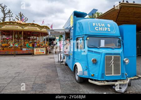 London, UK - 6 June 2023: A fish and chip van and carousel on the Southbank, London. A popular cultural centre with theatres, restaurants, bars, marke Stock Photo