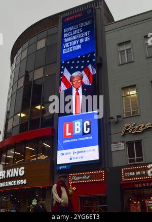 London, UK. 6th November 2024. A digital billboard in Leicester Square displays a news story from LBC that Donald Trump has won the US election against Kamala Harris. Credit: Vuk Valcic/Alamy Live News Stock Photo