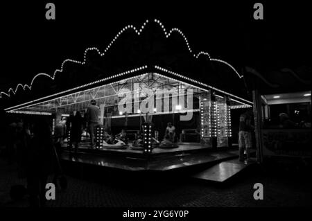 Monochrome view of a bumper car attraction at night Stock Photo