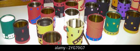 Several recycled cans that can be used to store pencils, for example. Stock Photo