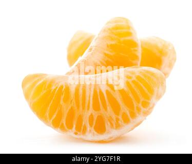Peeled pieces or slices of mandarin, tangerine or clementine isolated on white background Stock Photo