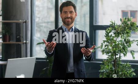 Caucasian man looking camera phone successful mature businessman entrepreneur leader employer professional manager indoors male business portrait Stock Photo