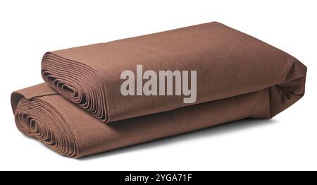 dark brown fabric floor carpet roll folded in half isolated white background, easy to handle, transport or store concept Stock Photo