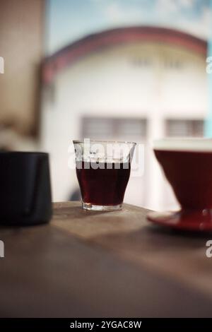 coffee beverage brewing method with the v60 technique, coffee is filtered with special paper so that coffee is produced without pulp Stock Photo