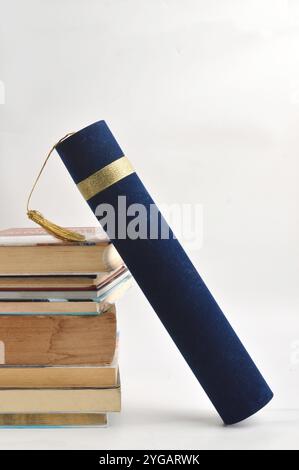 stacks of books and diploma on white background Stock Photo - Alamy