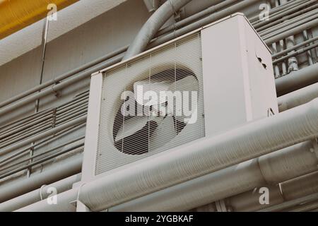 Air conditioner outdoor unit unit office building cooling system with pipeline. Stock Photo