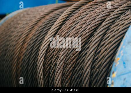 Old Industry Rusty Steel Cable Used Aged Grunge Weathered Steel Wire Or Steel Rope, Rope Sling Drum. Stock Photo
