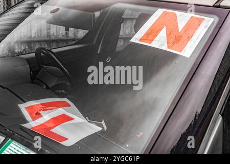 Replacing L plates with N plates (indicating the transition from learner to novice driver) on a car in Ireland, symbolizing a significant milestone in Stock Photo