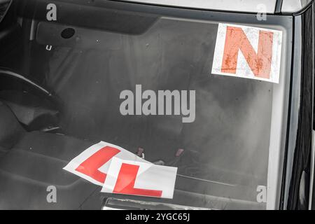 Replacing L plates with N plates (indicating the transition from learner to novice driver) on a car in Ireland, symbolizing a significant milestone in Stock Photo