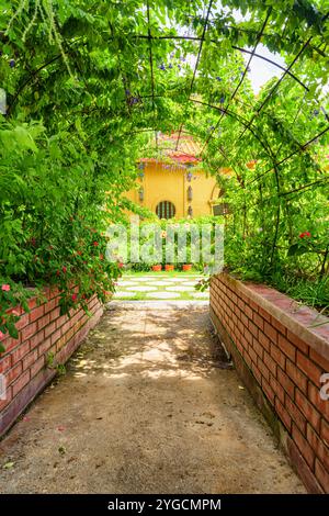 Scenic green pathway in the Kek Lok Si Temple, Penang Stock Photo