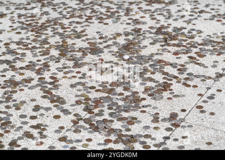 Coins scattered on stone floor, sacrifice, Japanese Gateway or Japanese Tor tor, Royal Botanic Gardens (Kew Gardens), UNESCO World Heritage Site, Kew Stock Photo