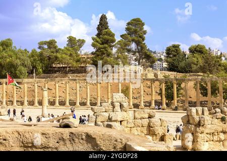 Jerash, Jordan, November 7, 2022: Square with row of Corinthian columns of Oval Forum Plaza at archaeological site, ruins of Greek and Roman period, A Stock Photo