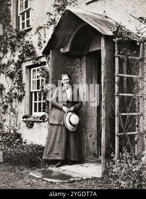 Helen Beatrix Potter, (1866-1943), English writer, illustrator, and conservationist at her home Hill Top Farm in the English Lake District, portrait photograph by Charles GY King, 1913 Stock Photo