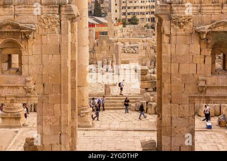 Jerash, Jordan, November 7, 2022: People visiting Gerasa ancient roman city, archs and ancient ruins, Asia Stock Photo