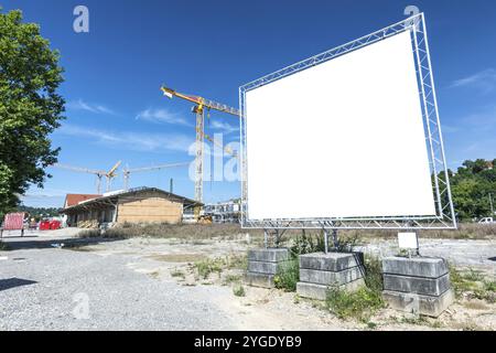 Large blank billboard on construction site Stock Photo