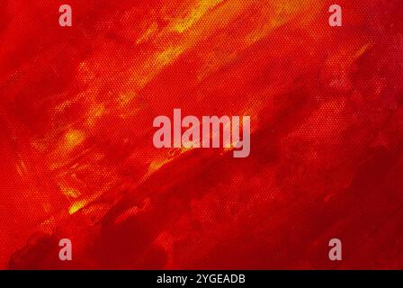 A close-up of deep red and yellow acrylic paint on canvas, showcasing a captivating interplay of colors and artistic depth. Stock Photo