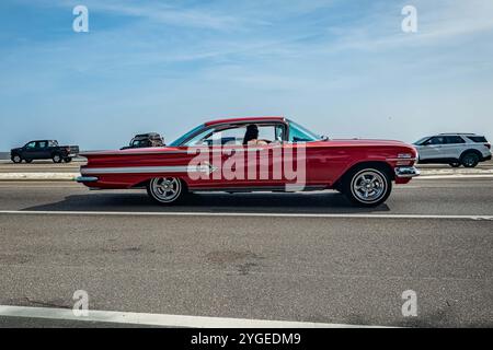 Gulfport, MS - October 04, 2023: Wide angle side view of a 1960 Chevrolet Impala Sport Coupe at a local car show. Stock Photo