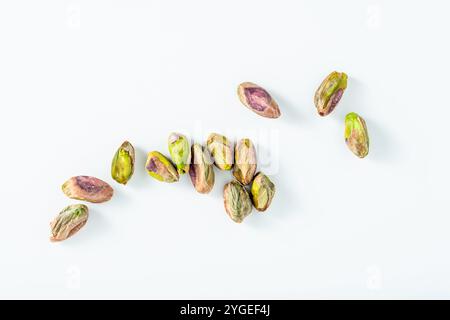 peeled pistachios on a white background. products for restaurants and markets Stock Photo