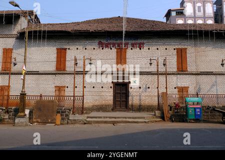 30 October 2024, Pune, India, Vishrambaug Wada, Richly wood carved door fixed in brickwork at entrance of Vishrambaug Wada second palace of Peshve the Stock Photo