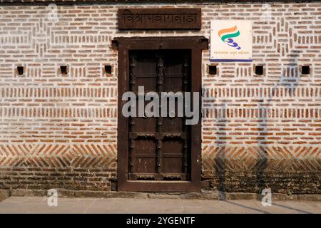 30 October 2024, Pune, India, Vishrambaug Wada, Richly wood carved door fixed in brickwork at entrance of Vishrambaug Wada second palace of Peshve the Stock Photo