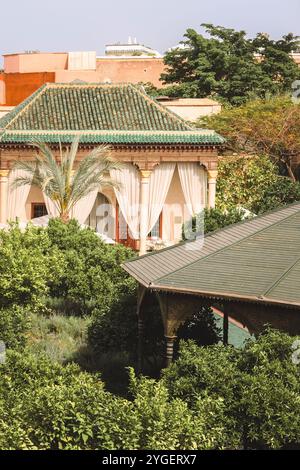 Le Jardin Secret botanical garden Marrakech, beautiful lush green tropical plants and palm trees with traditional Moroccan architecture, Morocco Stock Photo