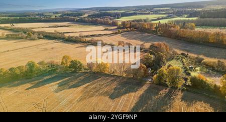 Pluscarden Abbey a Catholic Benedictine monastery near Elgin Scotland surrounded by harvested barley fields in autumn sunshine Stock Photo