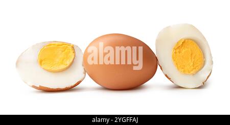 Side view of boiled or cooked brown chicken eggs with halves and egg yolk in stack is isolated on white background with clipping path. Stock Photo