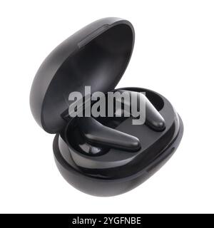 black earphones inside the case isolated on white background suitable for listening to music or talking on your smartphone Stock Photo