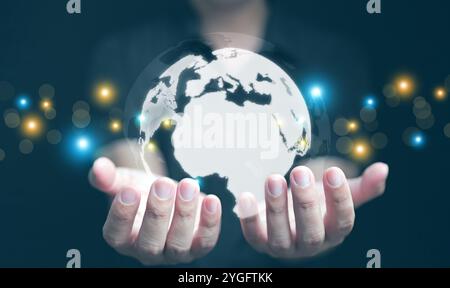 Globe in your hands concept. A businessman can use, control, and access communication, information, data, and networks globally Stock Photo