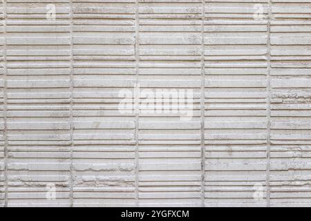 Abstract weathered texture stained old stucco light gray and aged paint white brick wall background. Brick wall may used as background. Stock Photo