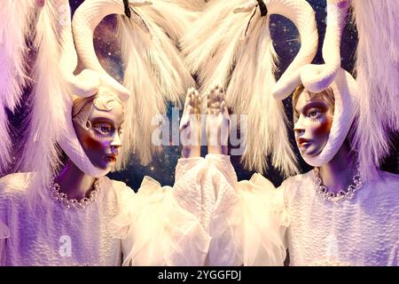 Christmas display in the window of Selfridges department store on Oxford Street, London, featuring Bespoi e Swans dresses by designer Simone Rocha. Stock Photo