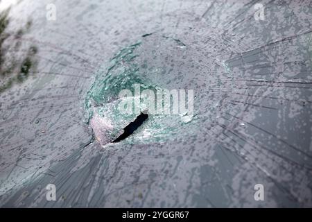 A stone impact shattered a car's windscreen after travelling several metres at 106mph during Storm Ciaran. Stock Photo