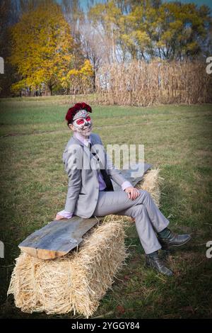 Portrait of a woman wearing a typical Day of the Dead mask at a Santa Muerte celebration in Red Hook, New York. Stock Photo