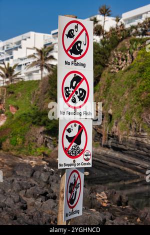 sign restrictions forbidden on Durban Ballito bay, travel destinations, Willard beach, hotels in the back Stock Photo