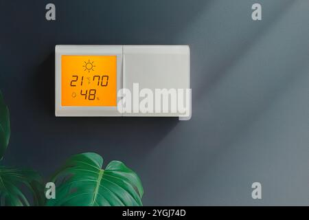 Climate controller. Smart home remote device. Adjust temperature. Appliances connected to home system. Modern home lifestyle. Smart office digital tou Stock Photo