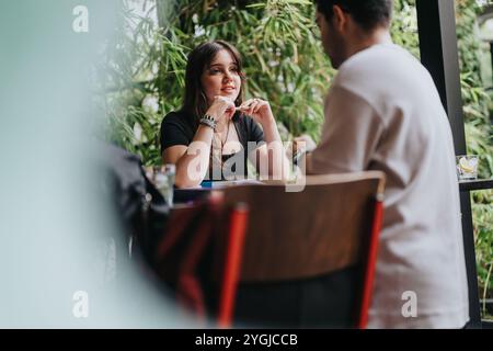 High school students collaborating on assignments in a cozy coffee shop Stock Photo