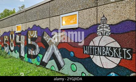 Graffiti on the exposed aggregate concrete façade of a sports hall, Germany, North Rhine-Westphalia, Ruhr Area, Witten Stock Photo