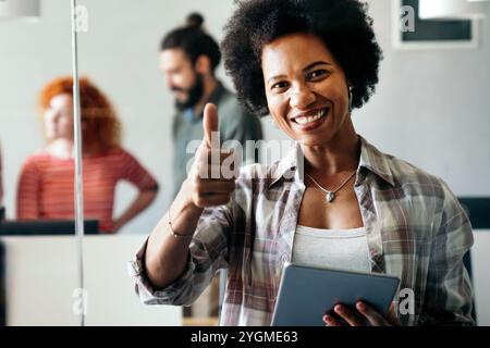 African american woman with tablet, innovation in research and programming for future app technology Stock Photo