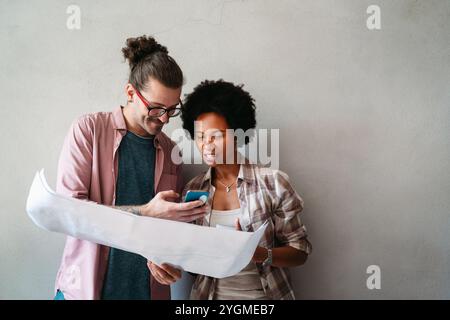 Young business people, engineers, managers working with new startup project in modern office Stock Photo