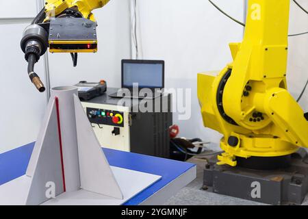 Industrial robot for automatic welding in a factory. Industry Stock Photo