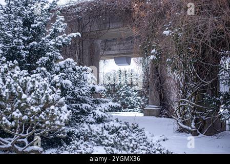 The snow-covered pergola near the Centennial Hall in Wrocław, Poland, creates a picturesque winter scene, inviting visitors to experience the charm an Stock Photo